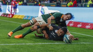 Shannon Frizell stretches for a try when tackled at The Rugby Championship