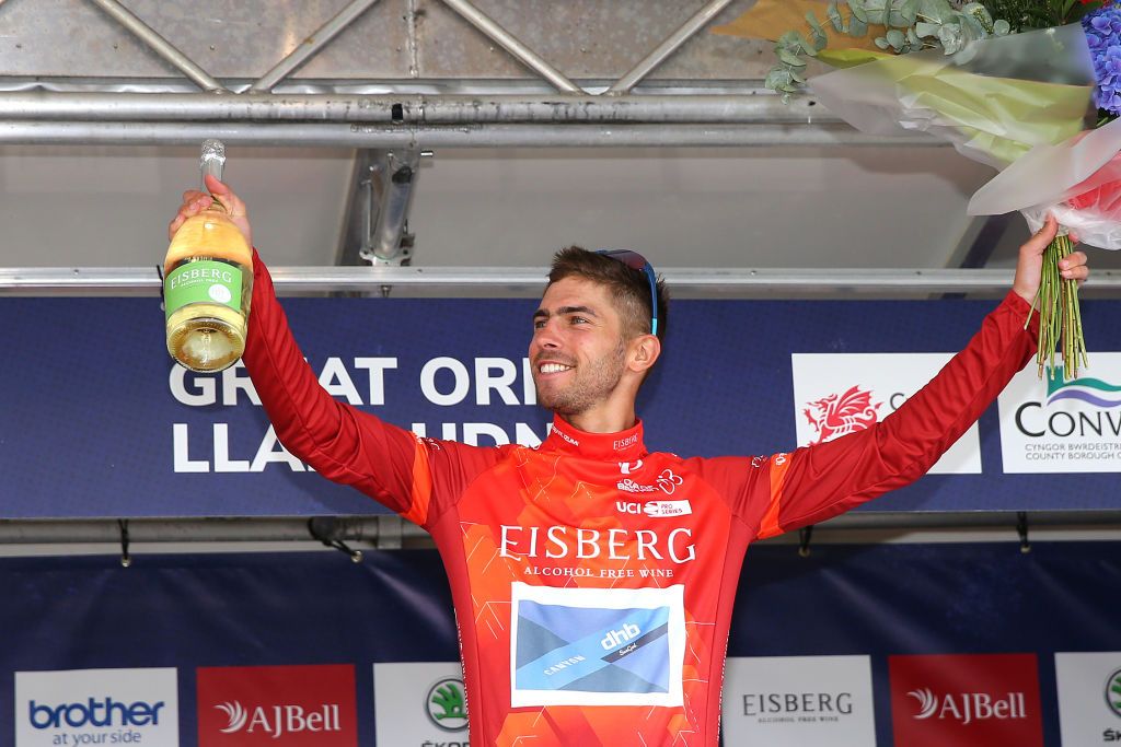 LLANDUDNO SEPTEMBER 08 Jacob Scott of United Kingdom and Team Canyon DHB Sungod celebrates winning the red sprint jersey on the podium ceremony after the 17th Tour of Britain 2021 Stage 4 a 210km stage from Aberaeron to Great Orme Llandudno 1306m TourofBritain TourofBritain on September 08 2021 in Llandudno United Kingdom Photo by Alex LiveseyGetty Images