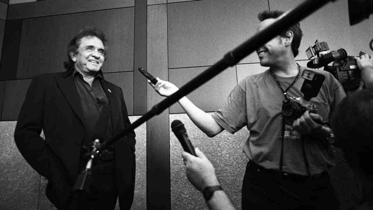 Johnny Cash being interviewed backstage at a show in 1994