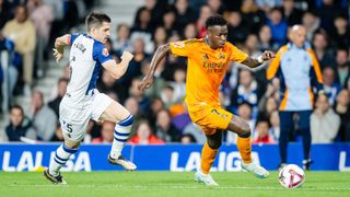 Igor Zubeldia of Real Sociedad, Vinicius Junior of Real Madrid during the LaLiga EA Sports match between Real Sociedad v Real Madrid at the Estadio Reale Arena on September 14, 2024 in San Sebastian Spain