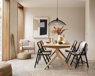 Natural Scandinavian style dining area with jute rug and chairs by John Lewis & Partners