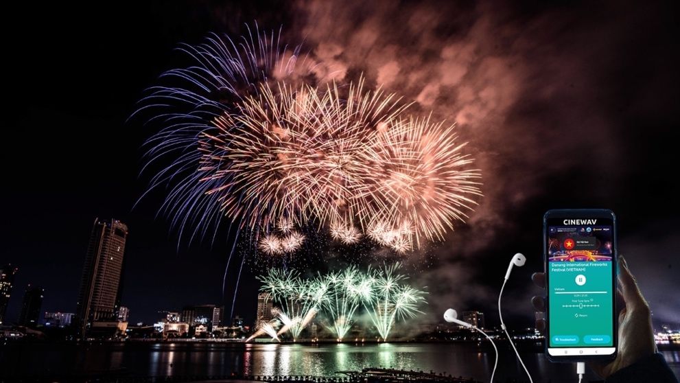 A fireworks display with an app, on a smartphone and wired headphones 