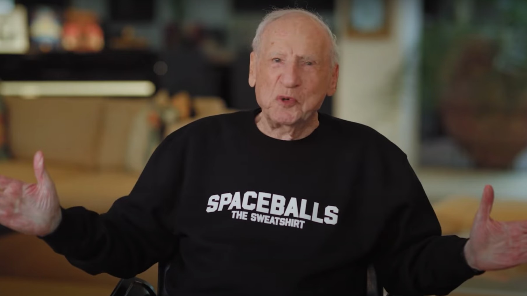 Mel Brooks in a Spaceballs sweatshirt