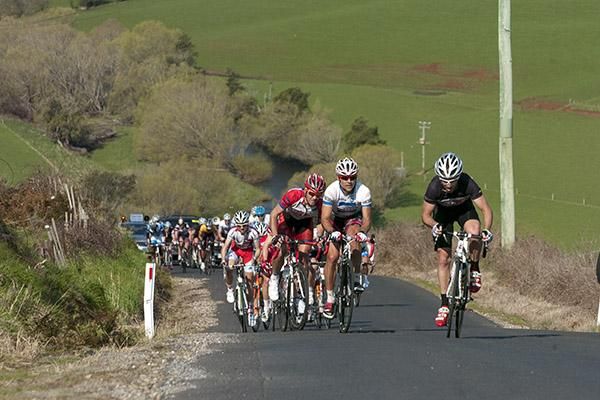 Riders at the back of the race wrestle with the climb at Gunns Plains.