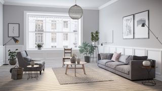 grey living room with pale grey walls with dark grey sofas and mixed tone accessories
