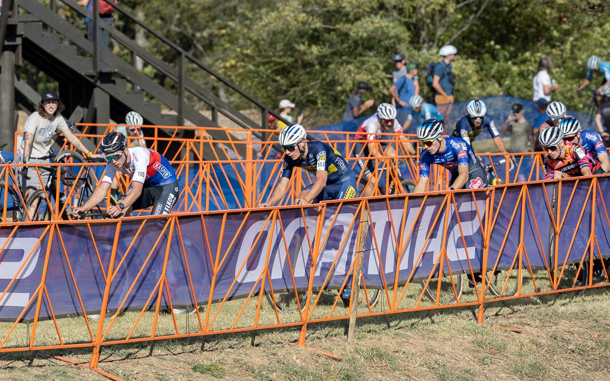 It took a few laps for the wind and the hill to break up the leaders of the race. Here 9 riders lead by Michael Boros (Elkov Kasper Czech Cycling Team), Lander Loockx (Deschacht - Hens - Maes), and Niels Vandeputte (Alpecin-Deceuninck) make their way past pit one.