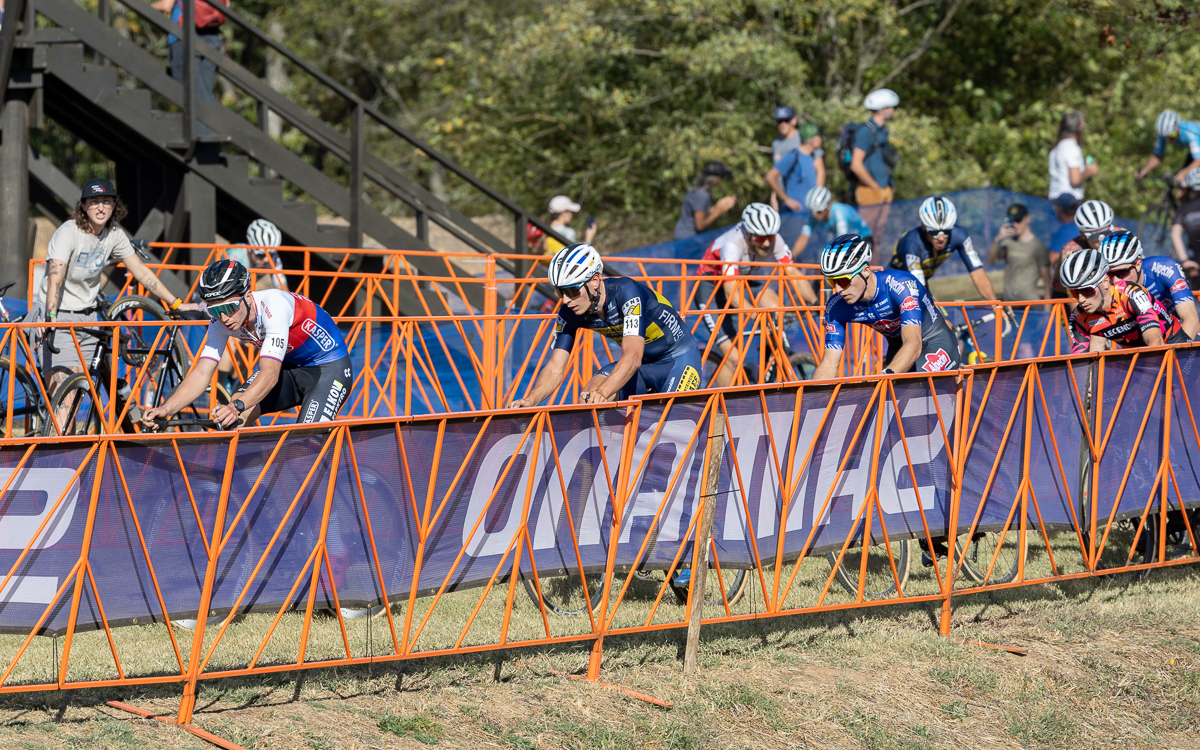 It took a few laps for the wind and the hill to break up the leaders of the race. Here 9 riders lead by Michael Boros (Elkov Kasper Czech Cycling Team), Lander Loockx (Deschacht - Hens - Maes), and Niels Vandeputte (Alpecin-Deceuninck) make their way past pit one.