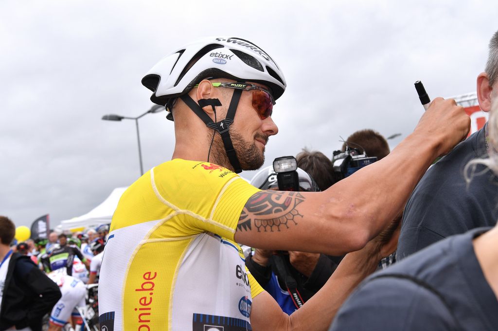 Race leader Tom Boonen (Etixx-QuickStep) signing autographs at the start of the stage