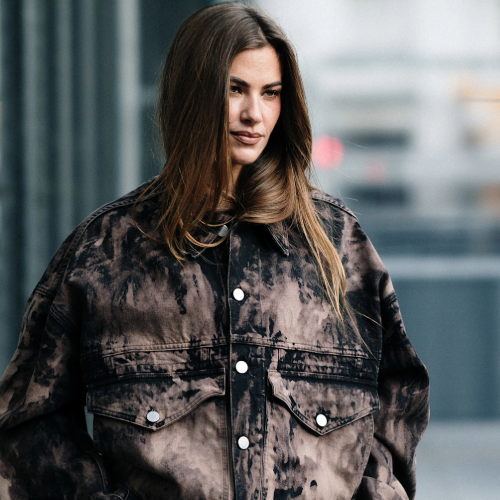 woman wearing a tie-dye jacket. 