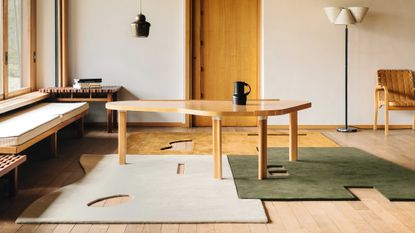 a irregualr shape table on rugs