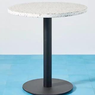 A terrazzo-topped side table
