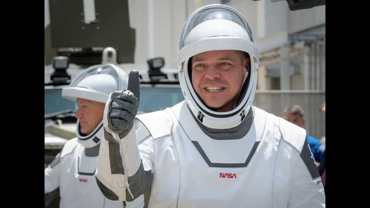 NASA astronaut Bob Behnken gives a thumbs-up sign while heading to the launch pad at the Kennedy Space Center in Florida for SpaceX's Demo-2 crew launch on May 30, 2020.