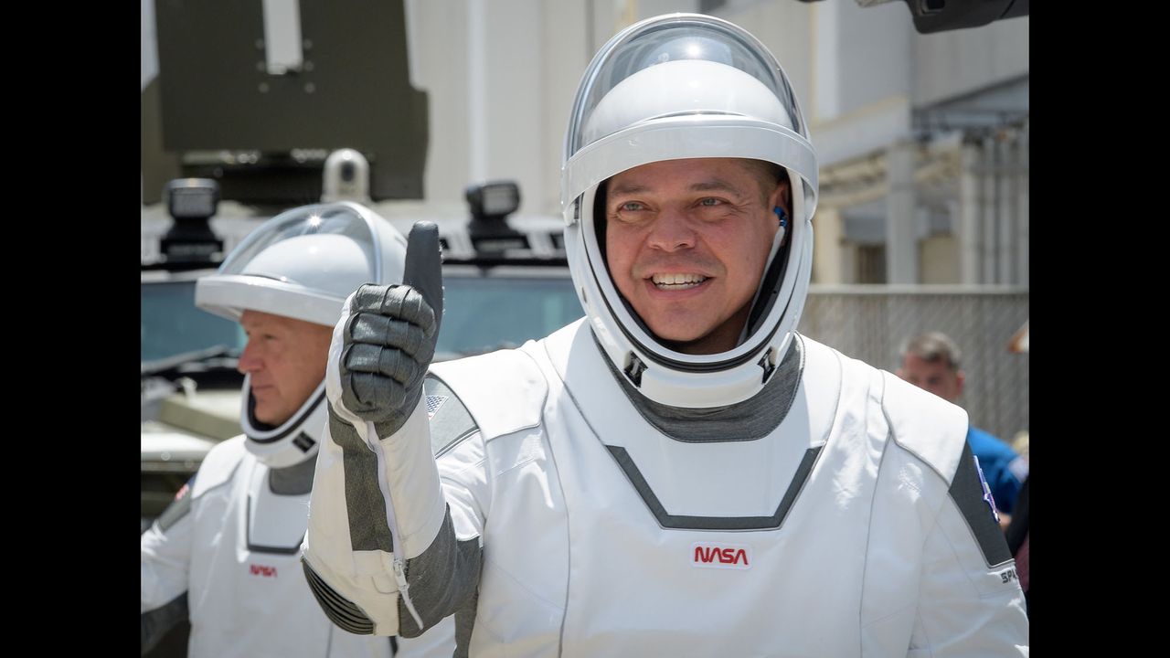 NASA astronaut Bob Behnken gives a thumbs-up sign while heading to the launch pad at the Kennedy Space Center in Florida for SpaceX's Demo-2 crew launch on May 30, 2020.