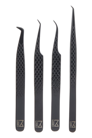 A set of four M lash tweezers set against a white background.