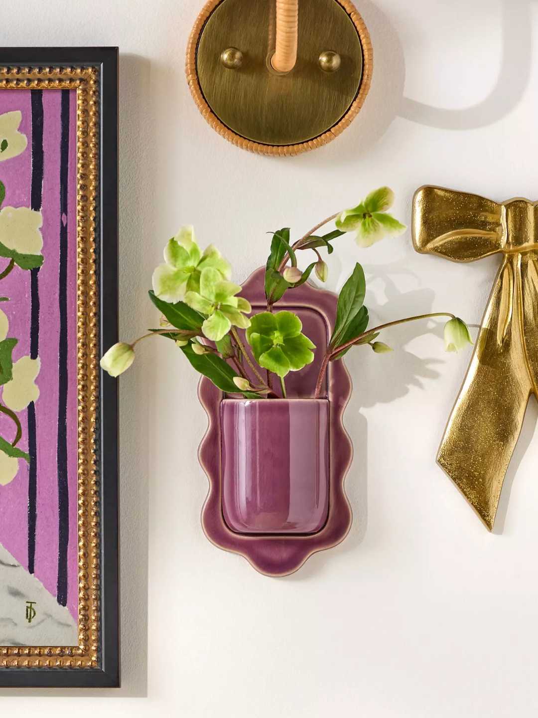 A purple stonware wall vase from Anthropologie