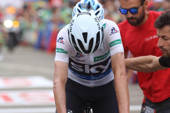 Chris Froome (Team Sky) gets a helping hand after the stage
