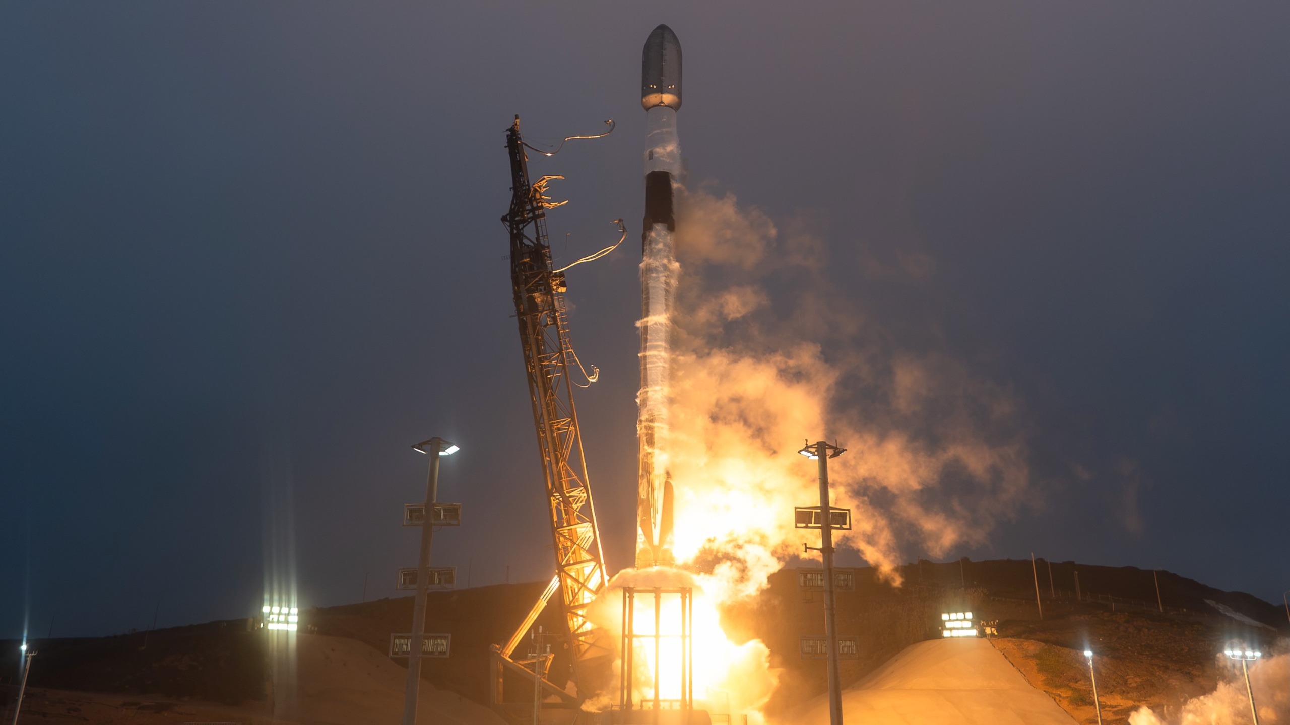 A SpaceX Falcon 9 rocket launches 27 Starlink satellites to orbit from Vandenberg Space Force Base in California on Sept. 19, 2026.