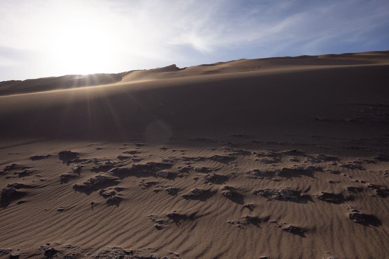 Sample image taken with the Sigma 15mm f/1.4 DC Contemporary showing sun flare over hills
