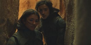 Timothee Chalamet and Zendaya walking through a cave in Dune