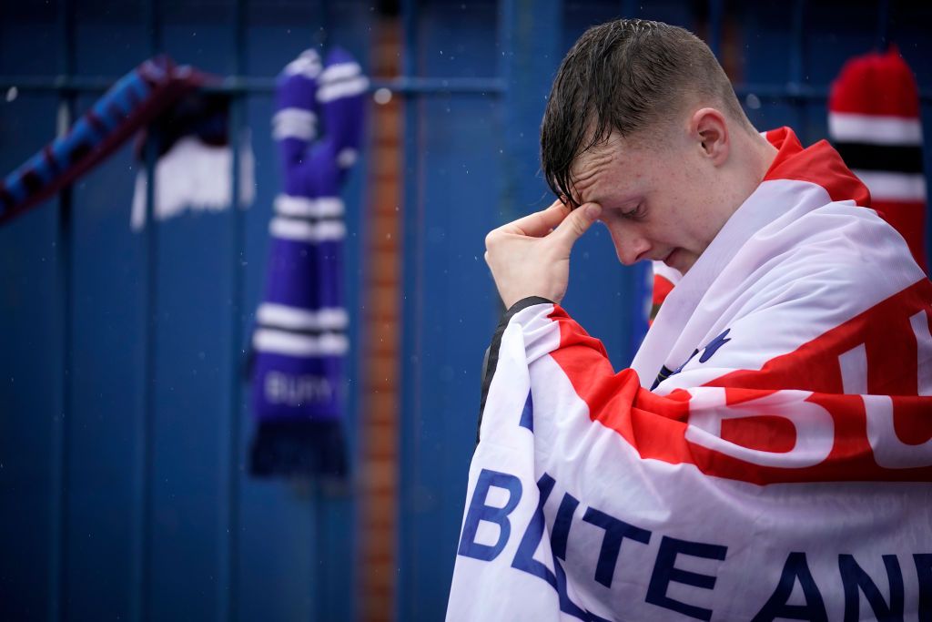 Fans gather outside Gigg Lane Stadium the home of Bury Football Club who have been expelled from the English Football League (EFL) on August 28, 2019 in Bury, England. After an historic membership of 125 years the EFL have expelled Bury FC after a buyer for the club was not secured.