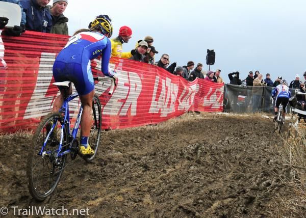 Nash chases Compton up the muddy hill.