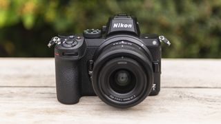 Nikon Z5, one of the best beginner mirrorless camera, on a wood surface