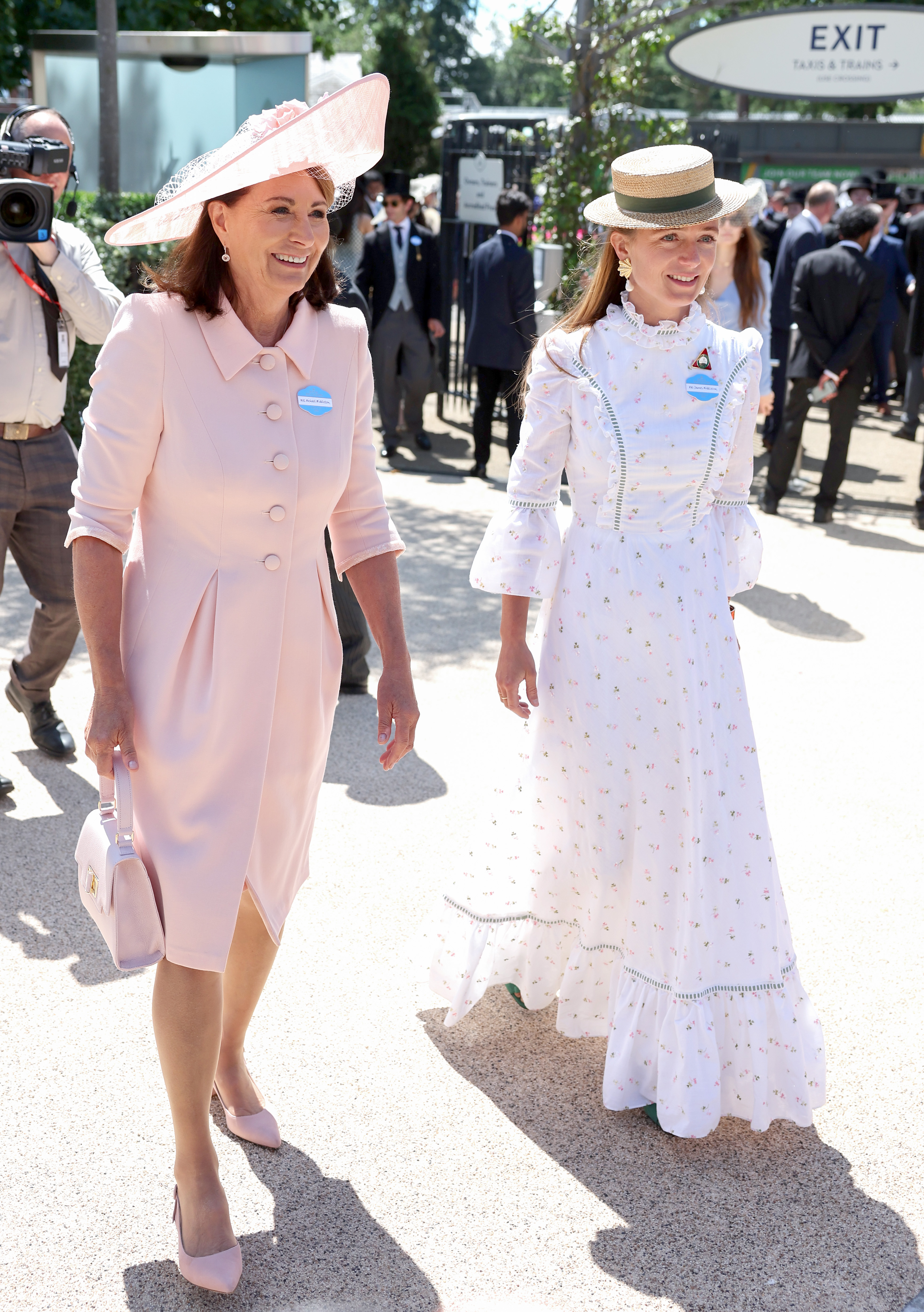 Carole Middleton wears a baby pink dress and matching hat, while carrying a top handle bag in the same shade to attend Royal Ascot 2026