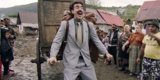 Borat Subsequent Moviefilm Borat pulls a cart through his village