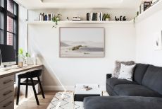 Small home office with neutral color scheme and shelving