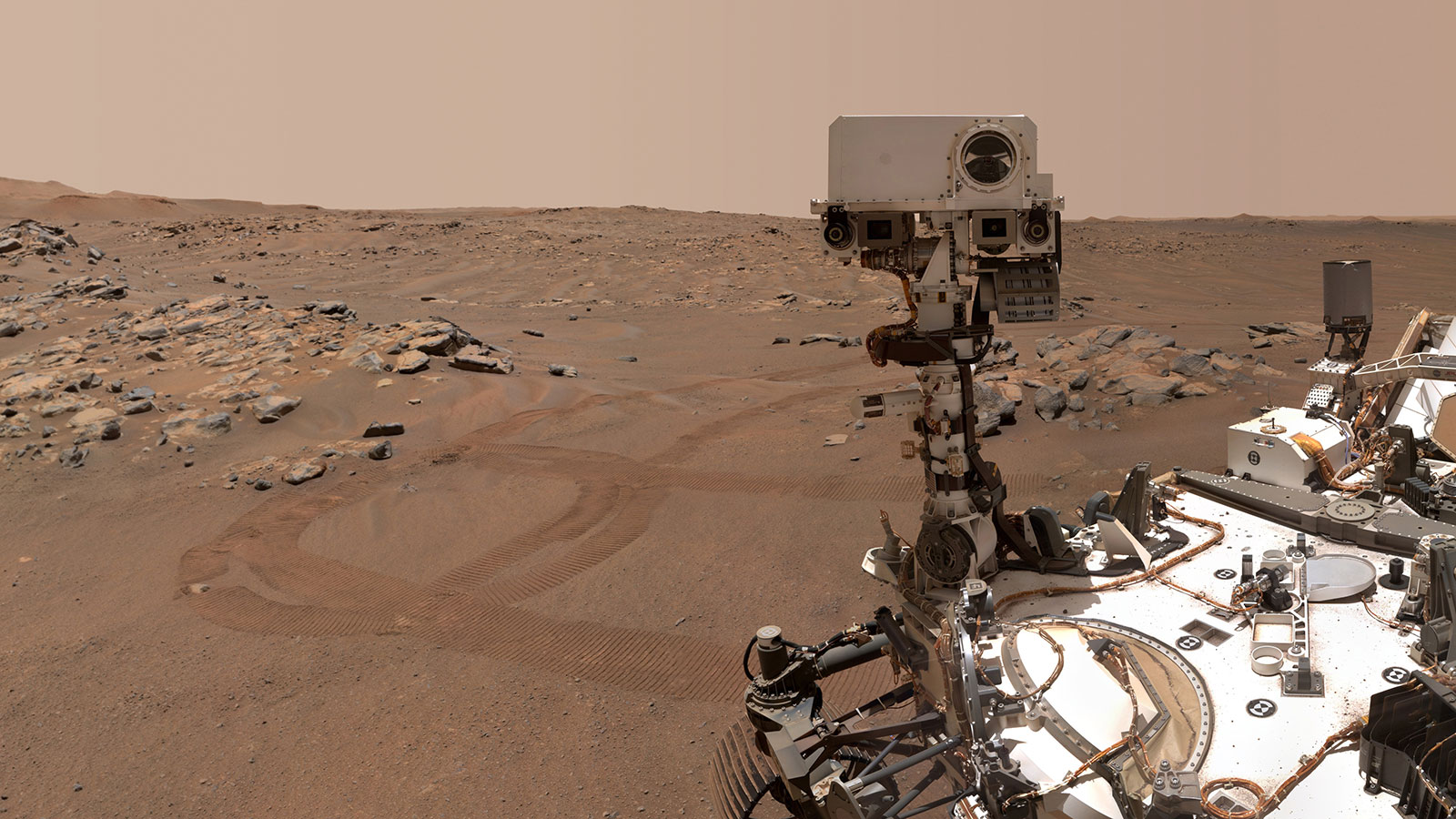 A large robot against a reddish landscape