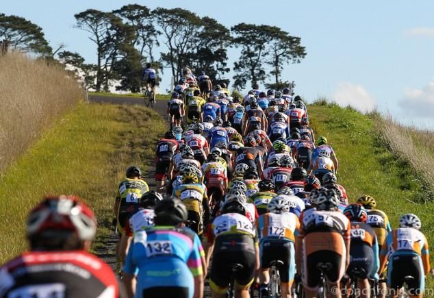 The peloton climbing a short hill