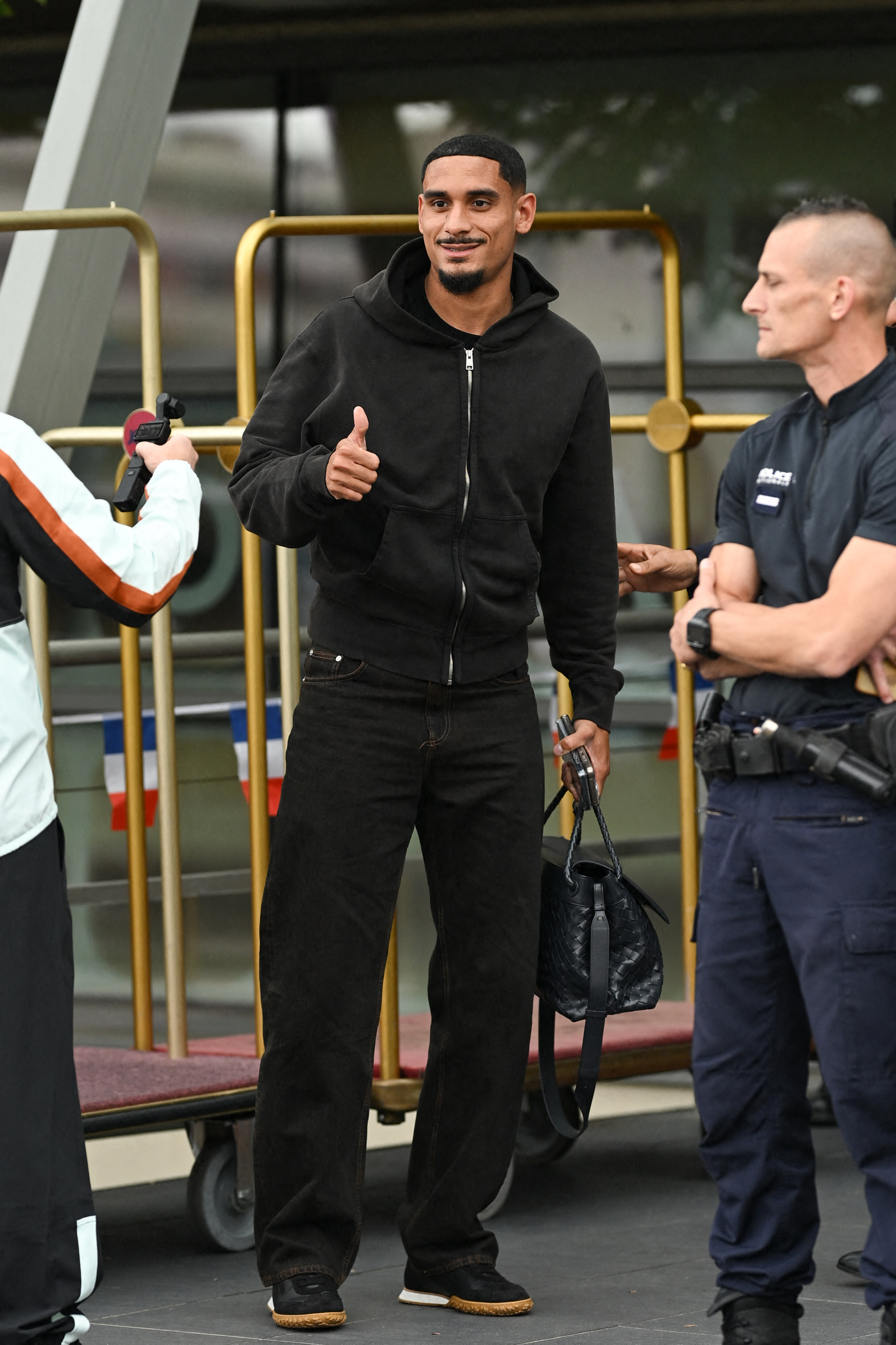 Maxence Lacroix carrying a Bottega Veneta bag to the 2026 World Cup