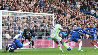 Jeremy Doku taking a shot during a Chelsea vs Man City game