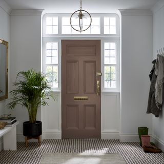 An entryway with a brown door