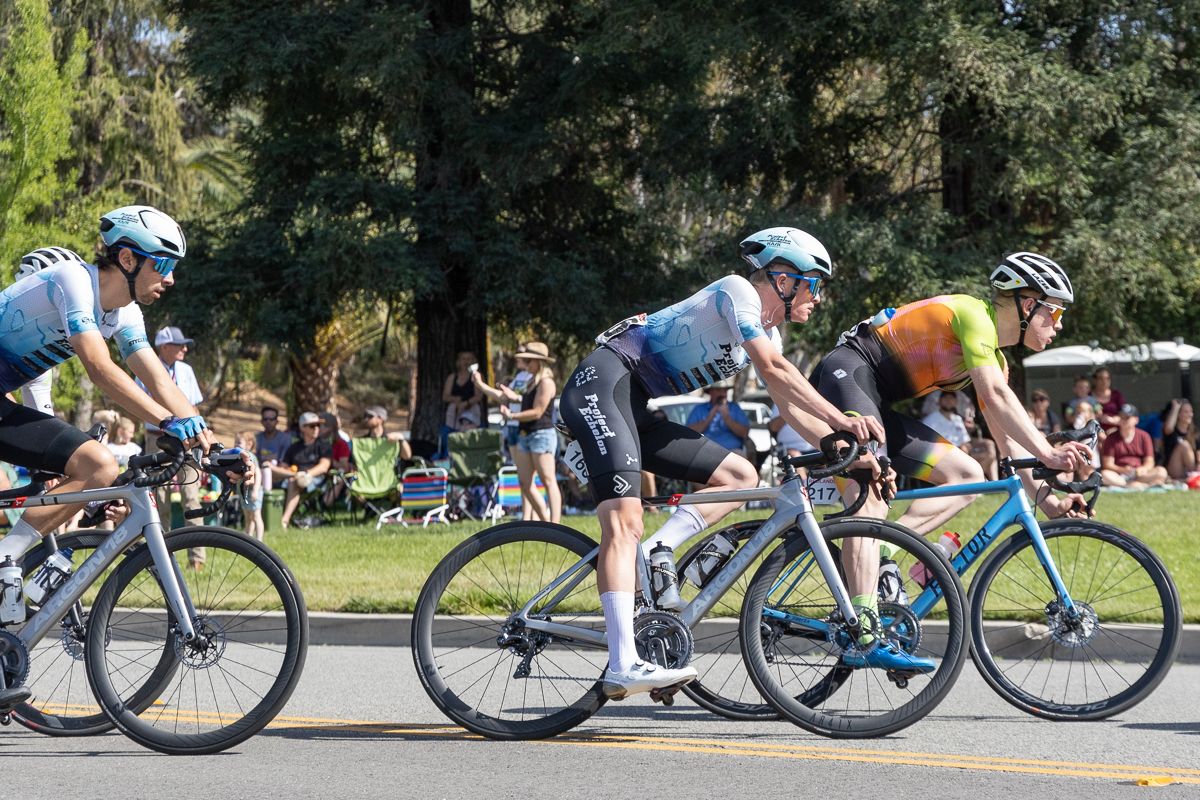 Tyler Stites (Project Echelon Racing, center) eventual GC winner, spent most of the day crusing in the peloton surounded by teammates including Hugo Scala, Jr (left)