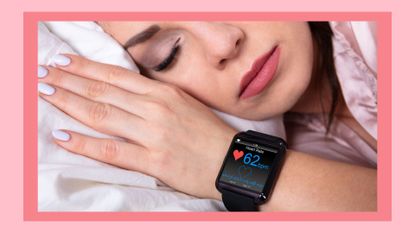 Woman Sleeping On Bed With Smartwatch Showing Heartbeat Rate, sleep trackers, best sleep trackers
