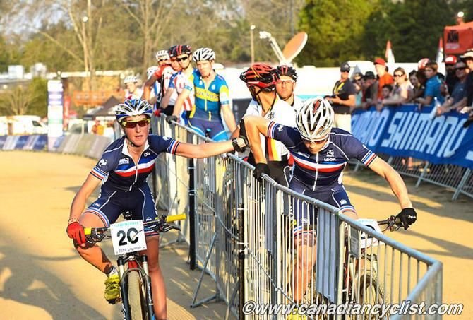 France's Julie Bresset hands off to Maxime Marotte