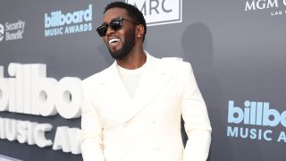 Diddy at the 2022 Billboard Music Awards in outfit reminiscent of his famous White Parties.