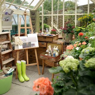 conservatory with flower pots and gumboots