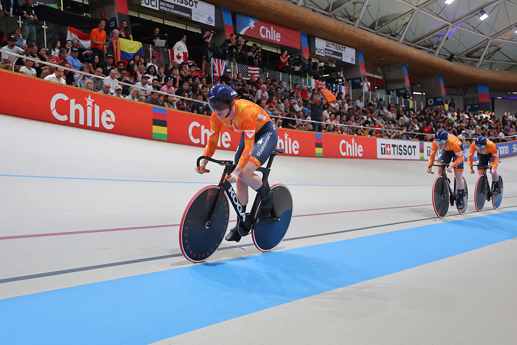 Netherlands&#039; #121 Kimberly Kalee, #122 Hetty Van de Wouw and #123 Steffie Van der Peet compete in the women&#039;s team sprint first round during the 2025 UCI Track World Championships at the Penalolen Velodrome, in Santiago, on October 22, 2025. (Photo by Javier TORRES / AFP)