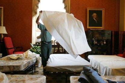 Carlos Abarca sets up beds for senators staying at the U.S. Capitol overnight for a filibuster debate.