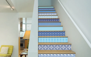 Staircase with blue patterned risers