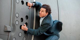 Tom Cruise hanging onto plane in Mission Impossible Rogue Nation