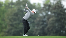 Rory McIlroy at the top of his back swing during a practice round at The Masters