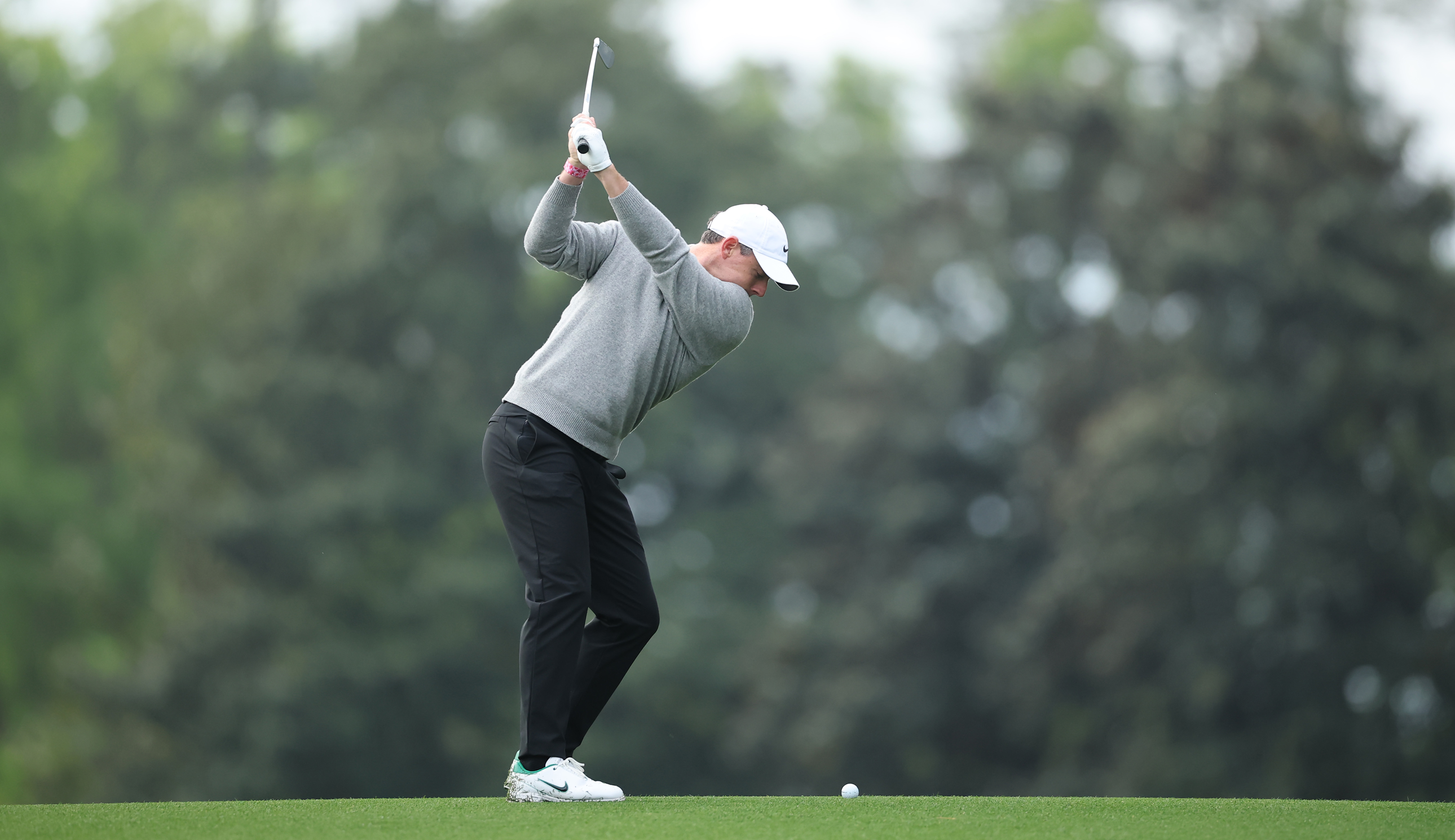 Rory McIlroy at the top of his back swing during a practice round at The Masters