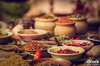 Spices and Herbs on Wooden Background by GMVozd