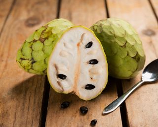 a cherimoya fruit sliced in two
