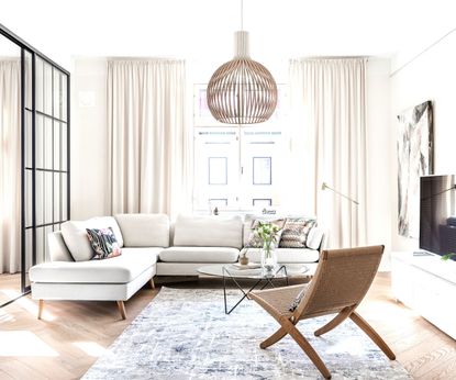 A minimalist living room with brown wooden chair