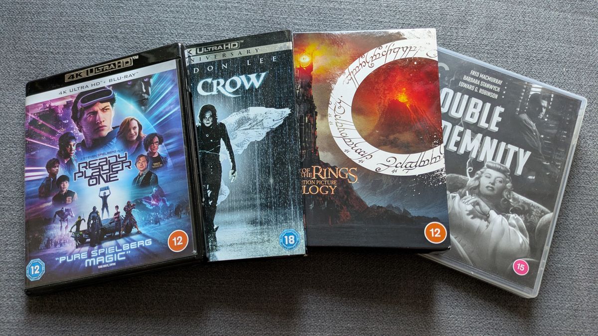 Four 4K Blu-ray cases of ready player one, the crow, lord of the rings and double indemnity in a line