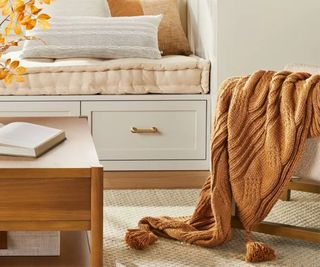 A Toasted Almond Chunky Cable Knit Throw in a modern home